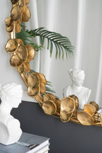 Round Metal Wall Mirror With Leaf Accents in Gold
